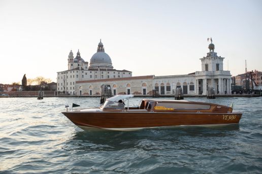 Water taxi crossing the Venice lagoon with Santa Maria della Salute in the background